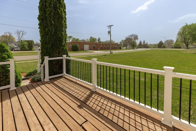 wooden deck with a lawn