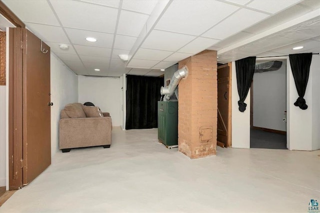 finished below grade area with recessed lighting and a paneled ceiling