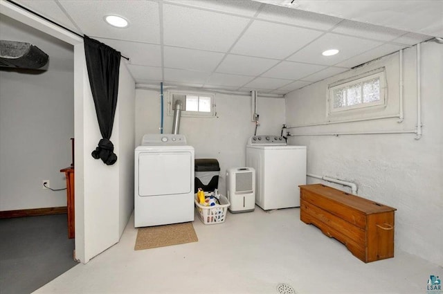 basement with washer and dryer, a drop ceiling, and recessed lighting