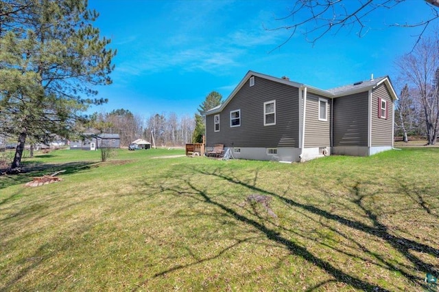 view of side of property featuring a yard