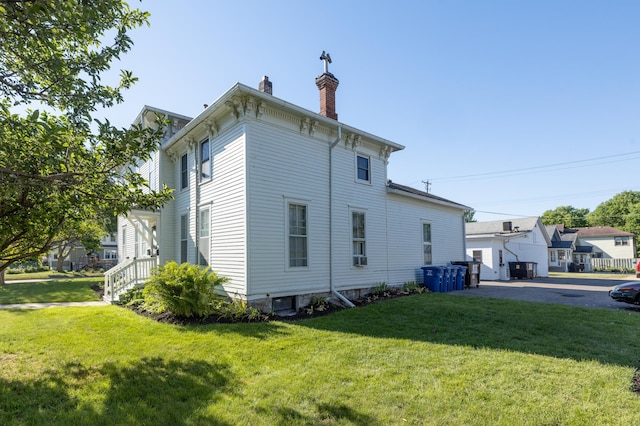 504 Buchanan St, Red Wing, MN 55066 - view of side of home with a chimney and a lawn