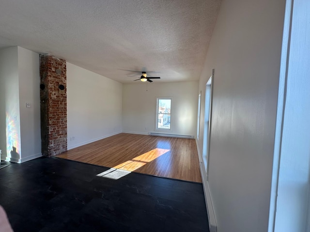 504 Buchanan St, Red Wing, MN 55066 - spare room with ceiling fan, a textured ceiling, wood finished floors, and baseboards