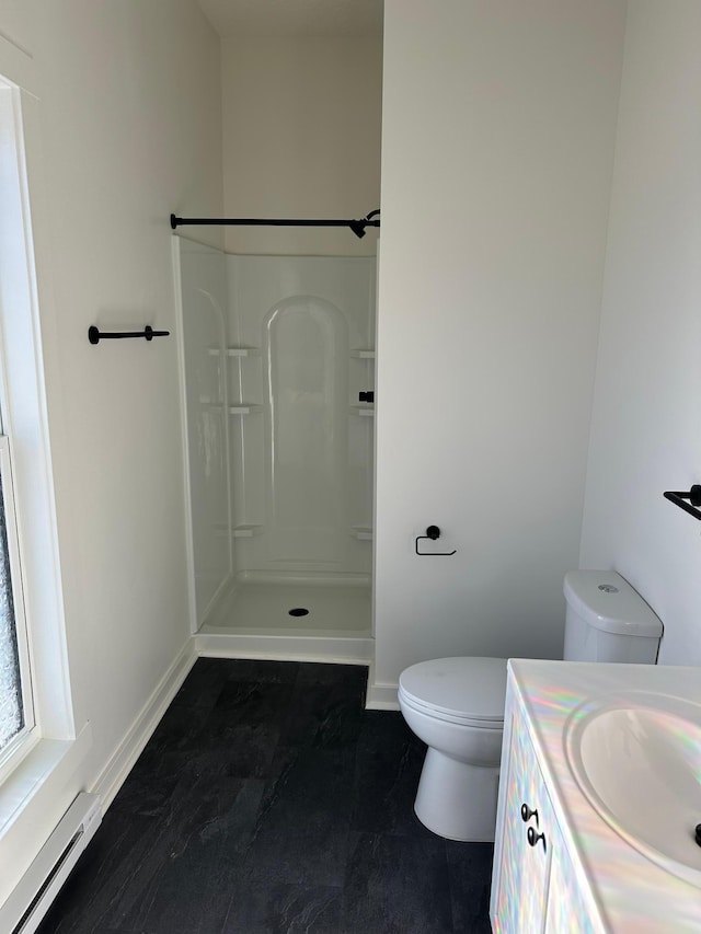 504 Buchanan St, Red Wing, MN 55066 - full bath with baseboard heating, toilet, a shower, vanity, and baseboards