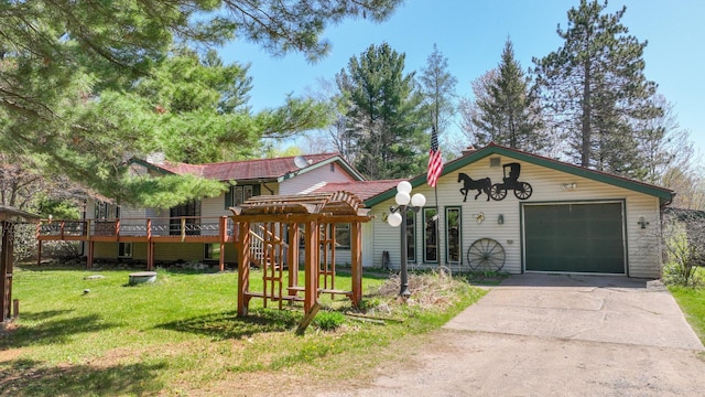 view of front of home with a front yard, driveway, a tiled roof, and a deck