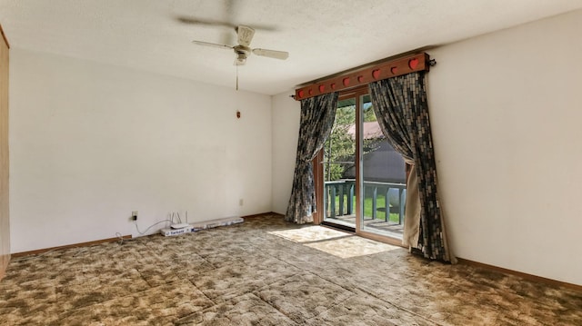 unfurnished room featuring ceiling fan and carpet floors
