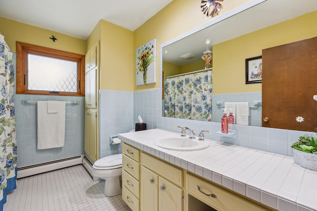 50 Lakeview Dr NW, Cokato, MN 55321 - full bathroom featuring baseboard heating, tile patterned flooring, vanity, toilet, and tile walls