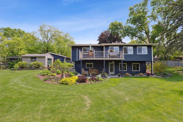 50 Lakeview Dr NW, Cokato, MN 55321 - back of property featuring a lawn, a wooden deck, and a patio area