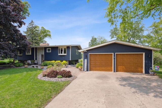 50 Lakeview Dr NW, Cokato, MN 55321 - view of front of property with a front yard, a chimney, a garage, and an outdoor structure