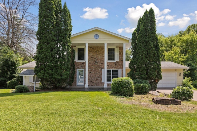 5235 139th St, Savage, MN 55378 - greek revival house with a front lawn, brick siding, and a garage