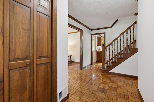 5235 139th St, Savage, MN 55378 - entrance foyer featuring a textured ceiling, stairs, and crown molding