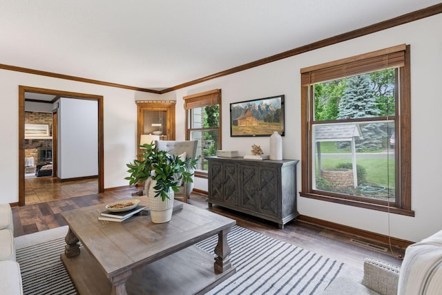 5235 139th St, Savage, MN 55378 - living area featuring plenty of natural light, wood finished floors, crown molding, and a fireplace