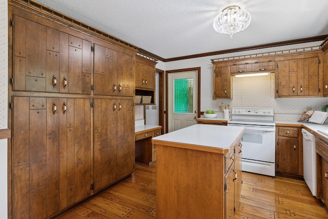 5235 139th St, Savage, MN 55378 - kitchen featuring white appliances, ornamental molding, light wood-style flooring, light countertops, and a kitchen island