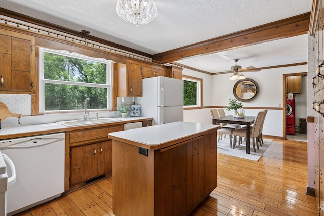 5235 139th St, Savage, MN 55378 - kitchen featuring white appliances, brown cabinets, light countertops, light wood-type flooring, and crown molding