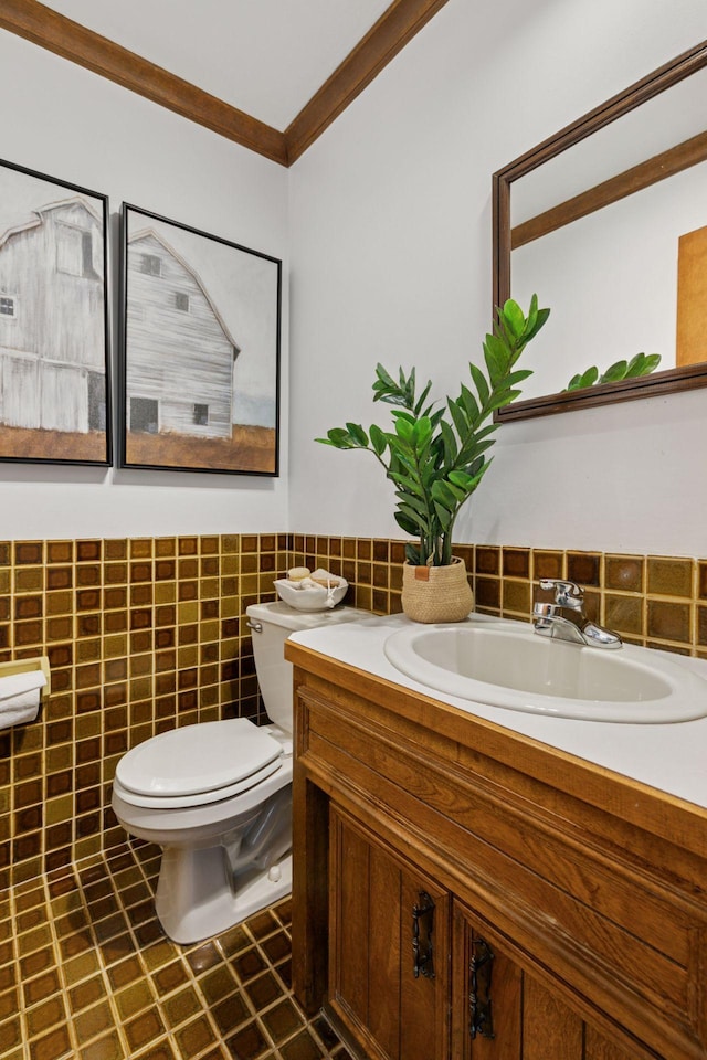5235 139th St, Savage, MN 55378 - half bathroom featuring vanity, crown molding, tile walls, a wainscoted wall, and tile patterned floors
