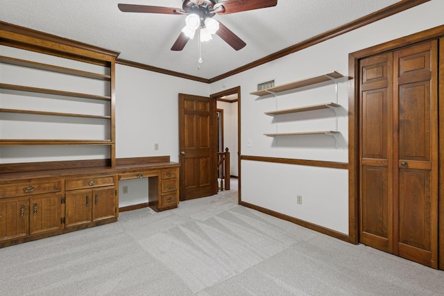 5235 139th St, Savage, MN 55378 - unfurnished office with ceiling fan, light colored carpet, built in desk, crown molding, and a textured ceiling