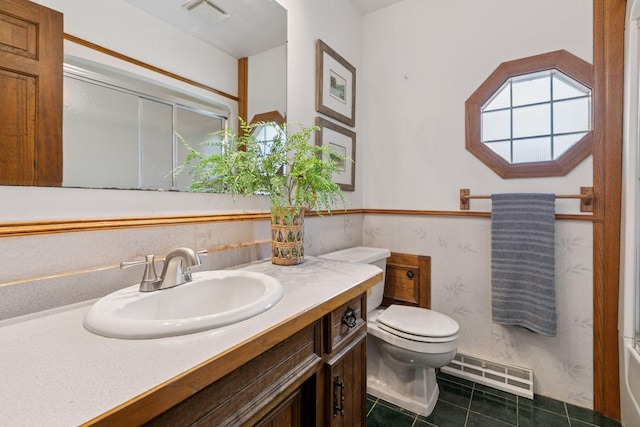 5235 139th St, Savage, MN 55378 - bathroom featuring tile patterned flooring, vanity, and a baseboard heating unit