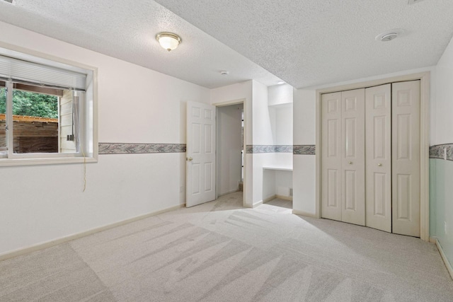 5235 139th St, Savage, MN 55378 - unfurnished bedroom with carpet, a textured ceiling, and a closet