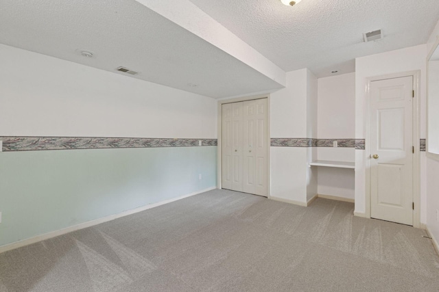 5235 139th St, Savage, MN 55378 - empty room featuring light colored carpet and a textured ceiling