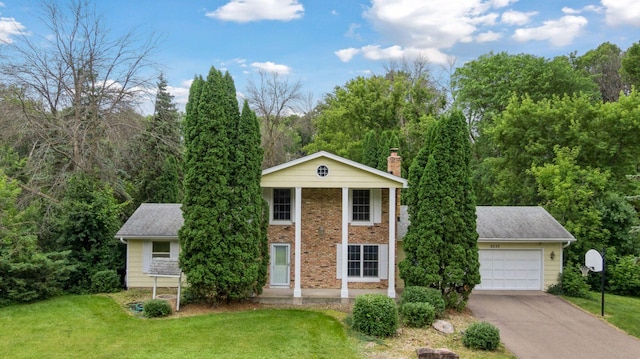 5235 139th St, Savage, MN 55378 - neoclassical home with a front lawn, a chimney, asphalt driveway, brick siding, and an attached garage