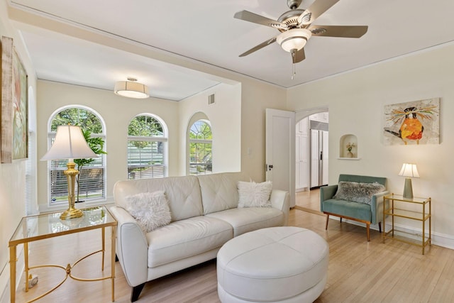 4201 Dupont Ave S, Minneapolis, MN 55409 - living room featuring wood finished floors, healthy amount of natural light, ceiling fan, and crown molding