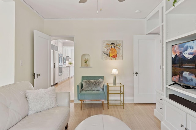 4201 Dupont Ave S, Minneapolis, MN 55409 - living area featuring light wood finished floors, arched walkways, and a ceiling fan