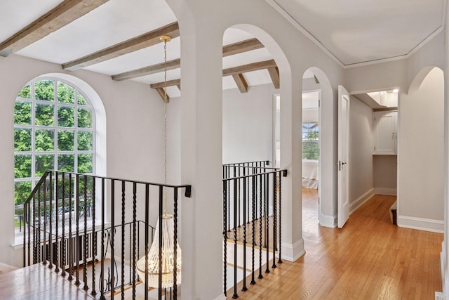 4201 Dupont Ave S, Minneapolis, MN 55409 - corridor with an upstairs landing, plenty of natural light, wood finished floors, baseboards, and beamed ceiling