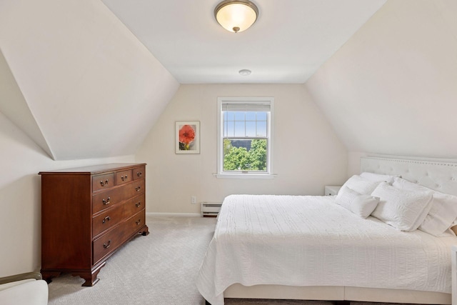 4201 Dupont Ave S, Minneapolis, MN 55409 - bedroom with light carpet, lofted ceiling, baseboards, and a baseboard radiator