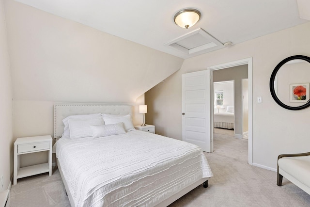 4201 Dupont Ave S, Minneapolis, MN 55409 - bedroom with attic access, light colored carpet, vaulted ceiling, and baseboards