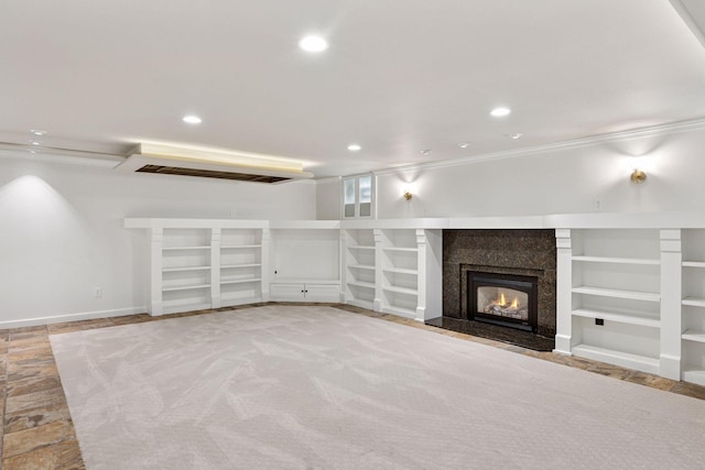 4201 Dupont Ave S, Minneapolis, MN 55409 - unfurnished living room with recessed lighting, a fireplace, built in features, and crown molding