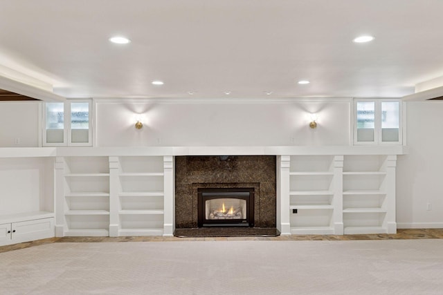 4201 Dupont Ave S, Minneapolis, MN 55409 - unfurnished living room featuring built in features, recessed lighting, and a premium fireplace