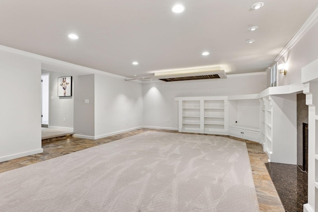 4201 Dupont Ave S, Minneapolis, MN 55409 - basement featuring ornamental molding, recessed lighting, baseboards, and a fireplace with raised hearth
