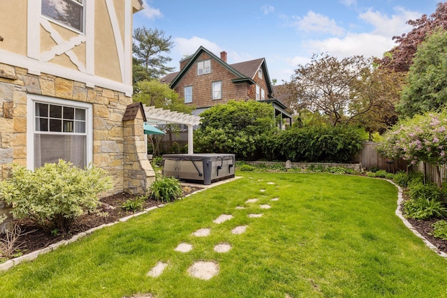 4201 Dupont Ave S, Minneapolis, MN 55409 - view of yard featuring a hot tub and a pergola