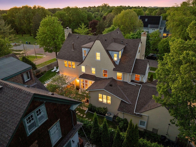 4201 Dupont Ave S, Minneapolis, MN 55409 - back of property with a chimney, stucco siding, and roof with shingles