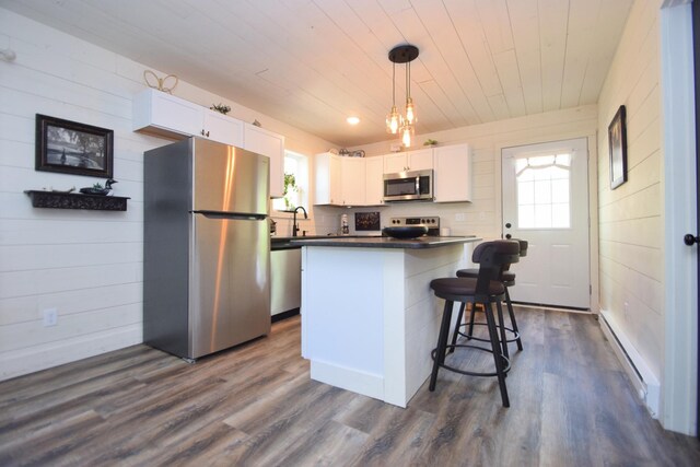 28607 Great Bear Path Way, Danbury, WI 54830 - kitchen with appliances with stainless steel finishes, white cabinets, dark countertops, a baseboard heating unit, and wooden ceiling