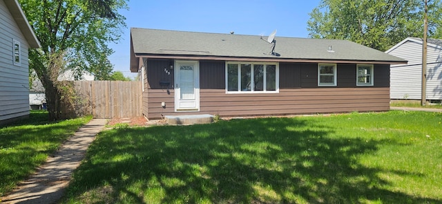 rear view of property featuring roof with shingles