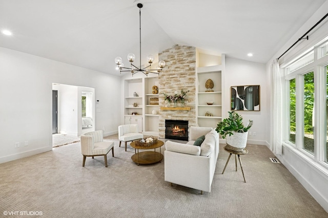 820 Vineland Ct, Chanhassen, MN 55317 - carpeted living area with a stone fireplace, baseboards, high vaulted ceiling, a chandelier, and built in shelves