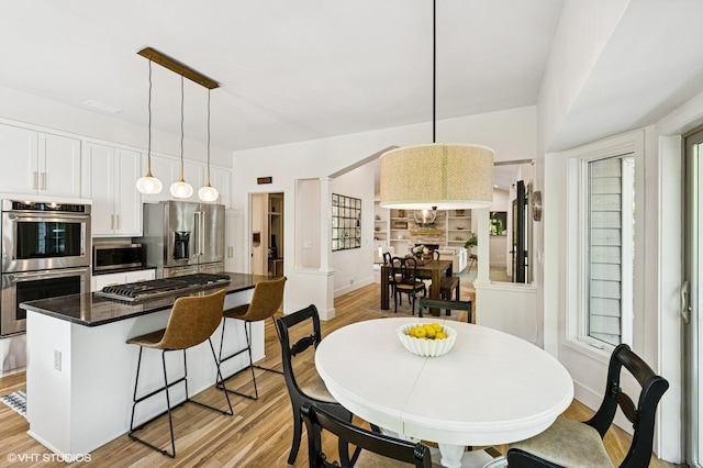 820 Vineland Ct, Chanhassen, MN 55317 - dining area featuring light wood-style floors, baseboards, and plenty of natural light