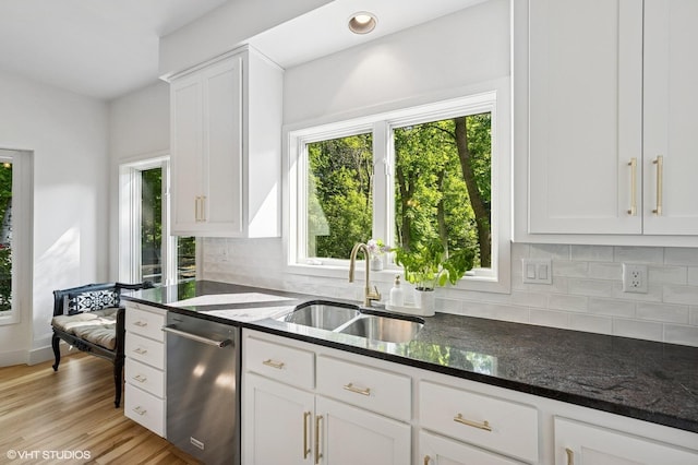 820 Vineland Ct, Chanhassen, MN 55317 - kitchen with dishwasher, a sink, dark stone counters, decorative backsplash, and white cabinetry