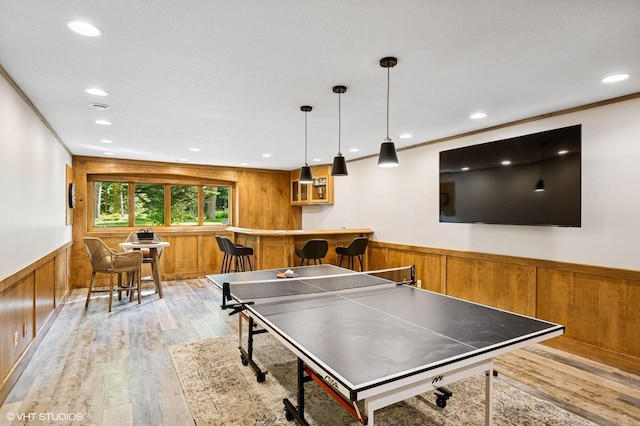 820 Vineland Ct, Chanhassen, MN 55317 - game room featuring wainscoting, wood walls, light wood-style floors, recessed lighting, and bar area