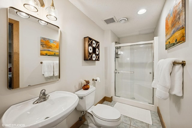 820 Vineland Ct, Chanhassen, MN 55317 - bathroom with a sink, baseboards, a shower stall, toilet, and a textured ceiling
