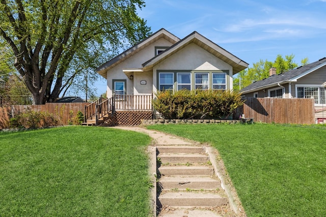 bungalow with stucco siding