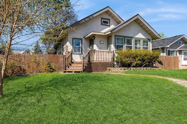bungalow featuring stucco siding