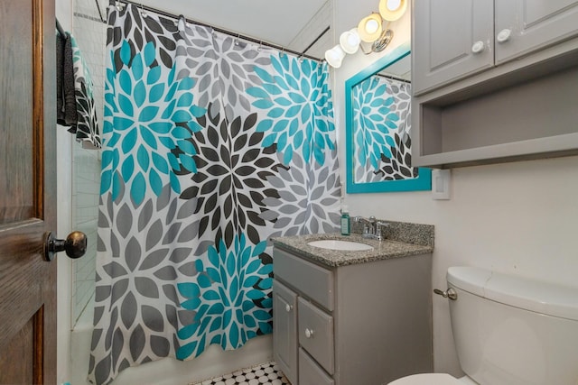 bathroom with toilet, vanity, and shower / bath combination with curtain