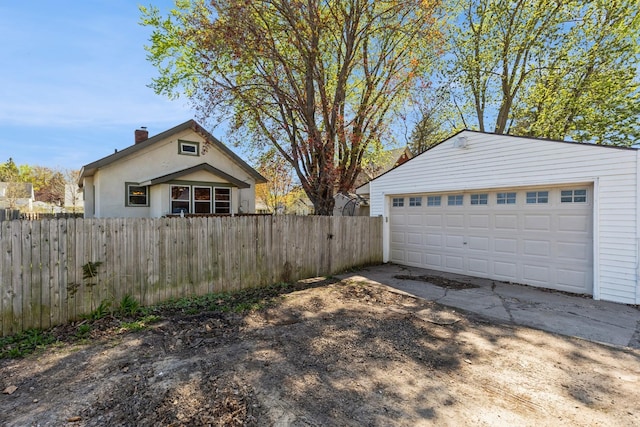 garage with fence