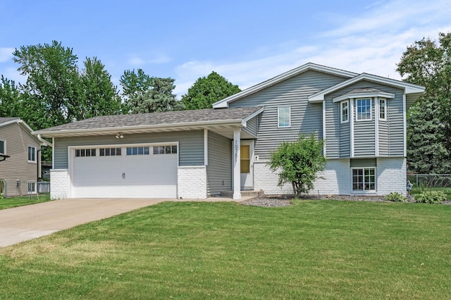 10751 Kumquat St NW, Coon Rapids, MN 55448 - tri-level home with brick siding, driveway, and a garage