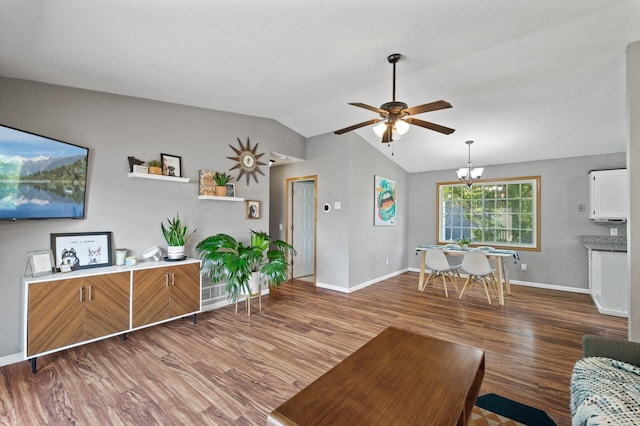 10751 Kumquat St NW, Coon Rapids, MN 55448 - living area featuring a ceiling fan, baseboards, wood finished floors, lofted ceiling, and a chandelier