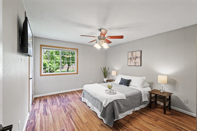 10751 Kumquat St NW, Coon Rapids, MN 55448 - bedroom with wood finished floors, baseboards, and ceiling fan