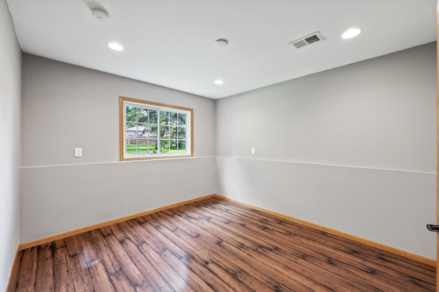 10751 Kumquat St NW, Coon Rapids, MN 55448 - empty room with wood finished floors, baseboards, recessed lighting, and a smoke detector