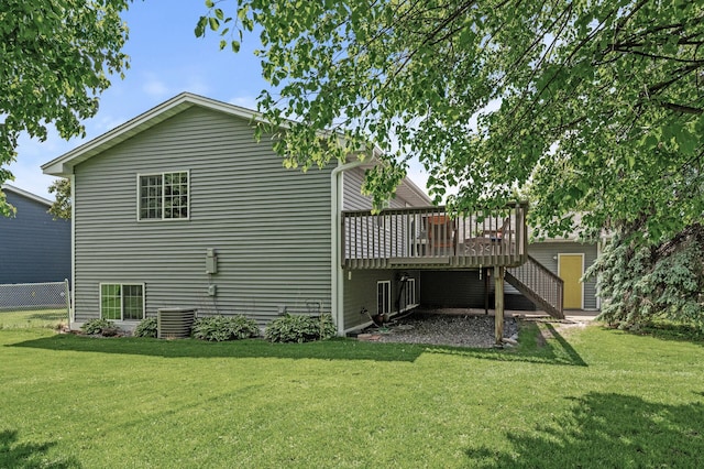 10751 Kumquat St NW, Coon Rapids, MN 55448 - rear view of house with stairway, a deck, and a yard