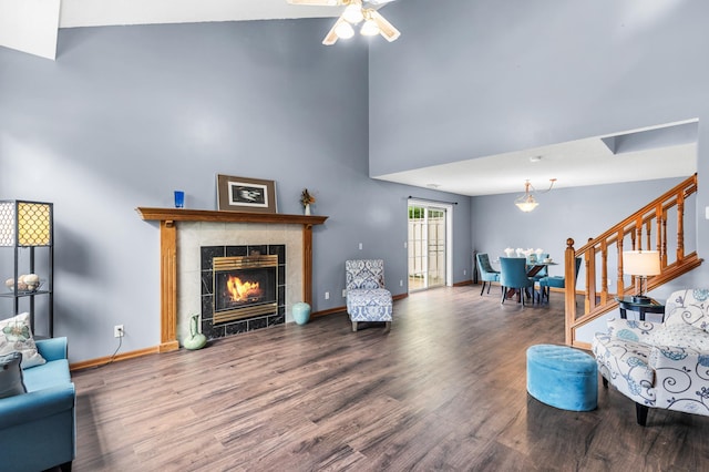 7954 Timber Lake Dr, Eden Prairie, MN 55347 - living area featuring wood finished floors, a high ceiling, stairway, a fireplace, and ceiling fan